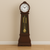 Wooden grandfather floor clock with quartz movement, Westminster chime, rich wood finish, intricate clock face, and pendulum design – elegant freestanding clock for traditional homes, offices, or formal interiors